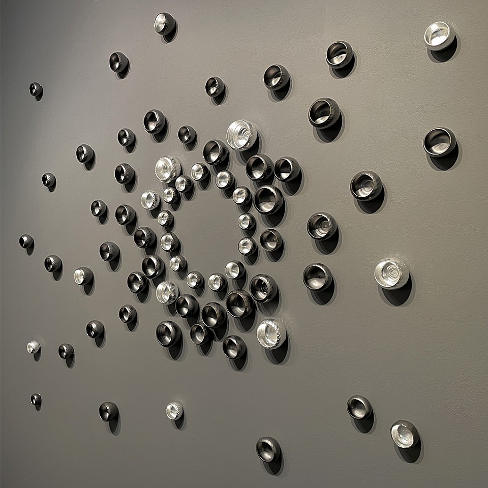 Lucrecia Waggoner, Of the Dark and the Light Within
Gunmetal glazed porcelain and silver leaf, dimensions variable (60x60" as shown)